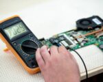 Close-up multimeter on the laptop.