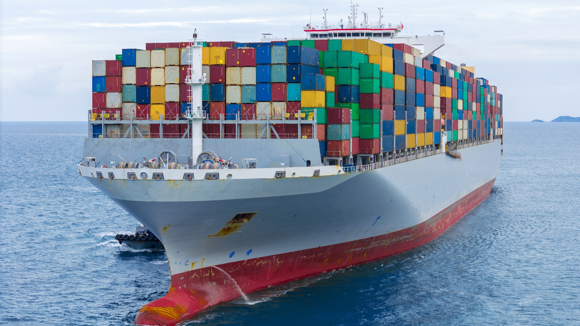 Front of Cargo container ship carrying container and running in international container