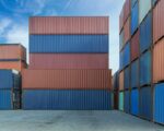 Stack of containers in a harbor. Shipping containers stacked on cargo ship.